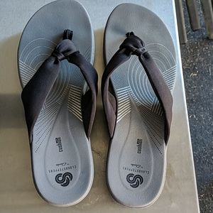 Possibly cursed wedge flip flops